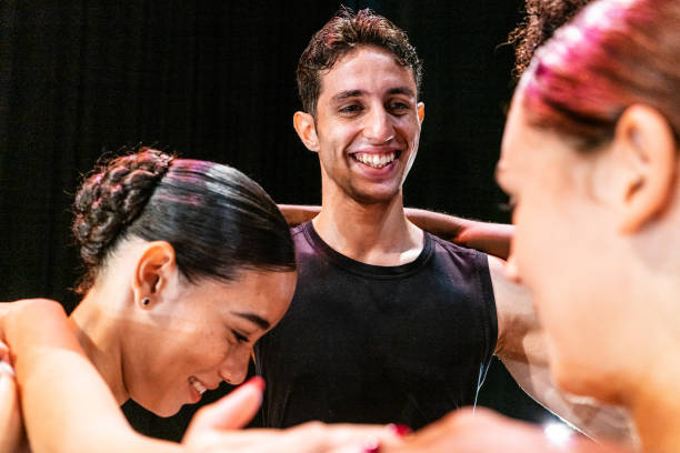 istock Young ballet dancers talking before the performance at stage theater 1708088773