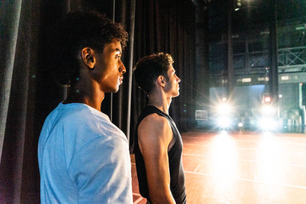Young ballet dancer men preparing to perform on the stage theater