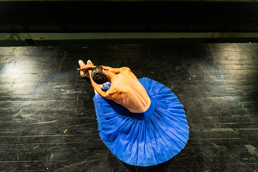 Young ballerina performing at stage theater