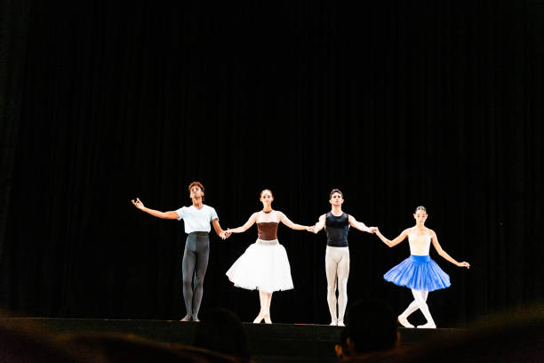 Young ballet dancers performing on a stage theater