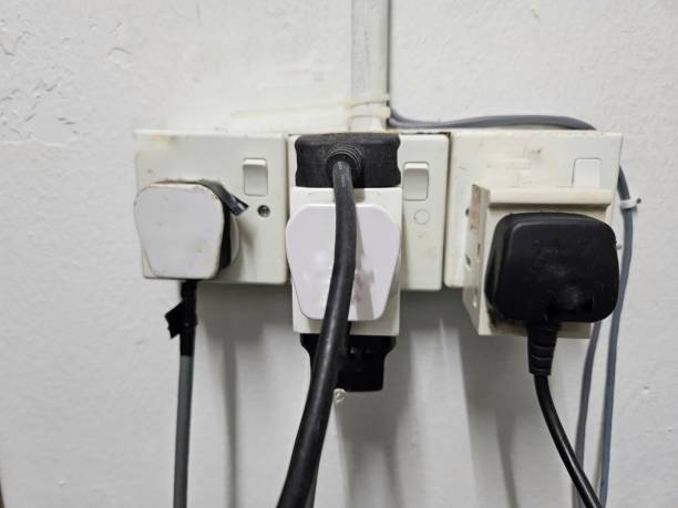 istock multi- socket power plug on the wall with a bunch of connected  plugs on it. 1708104340