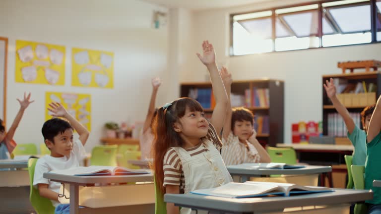 Teacher Providing Quality Education to Attentive School Children in Classroom.