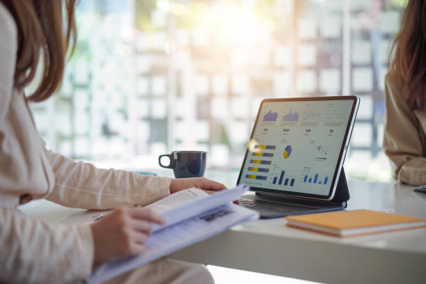 istock Businesswoman or accountant team analyzing data charts, graphs, and dashboard on laptop screen to increase sales and revenue. Business data analytics concept. 1708130443