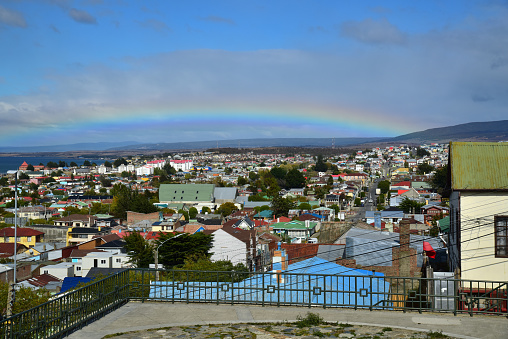 A rainbow arcs over the port town of Punta Arenas, Chile.