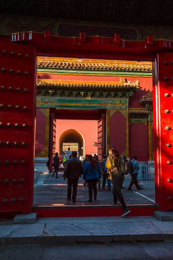 Beijing, China. October 28, 2015. Visitors leaving Beijing's Forbidden City Imperial Garden towards the North Gate