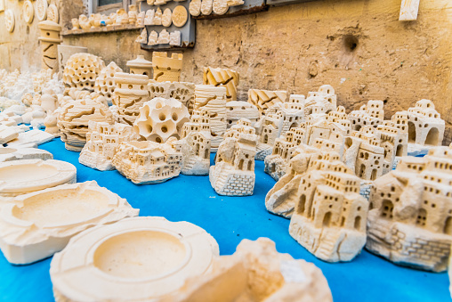 Matera, Italy - March 11, 2019: Replicas carved in stone from the typical cave houses of Matera.