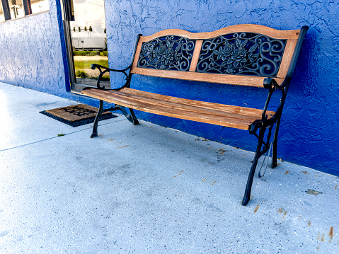 Wooden bench at storefront in Florida