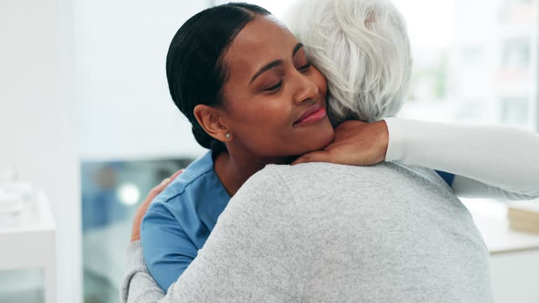 Nurse hug old woman patient, support and senior care with health and help, trust and retirement. Female people embrace, wellness and healthcare with empathy and caregiver, kindness and consultation