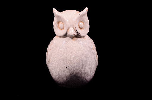 Clay Handmade Statue of a Owl on Black Background