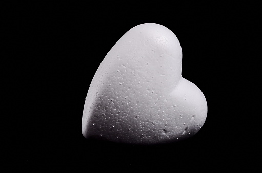 White Polystyrene Heart on a Black Background