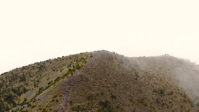 Aerial Drone View of El Ajusco Hillside Shrouded in Low Mist in Mexico.