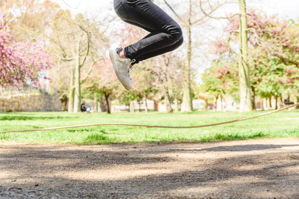 istock Girl playing jumping rope in a park in summer. 1708259610