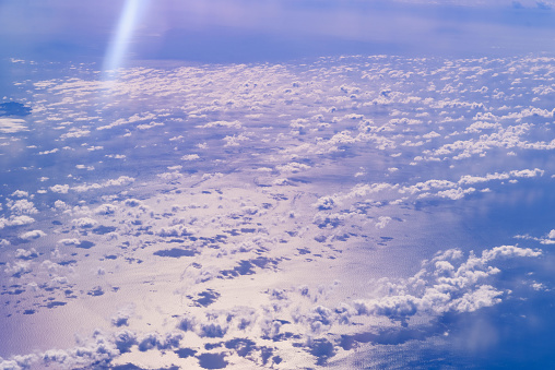 Sea of blue and white clouds seen from above.