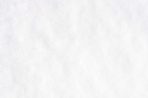 Winter snow. Snow texture Top view of the snow. Texture for design. Snowy white texture. Snowflakes