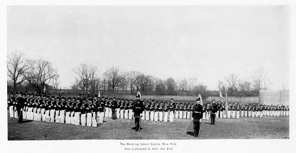 Cadets at Berkely School, Brooklyn, New York City, New York State, USA. Before Junior Reserve Officer Training Corps (JROTC) began in high schools in 1916, there was a military cadet program in elementary and high schools in the USA. Photograph published 1896. Original edition is from my own archives. Copyright has expired and is in Public Domain.
