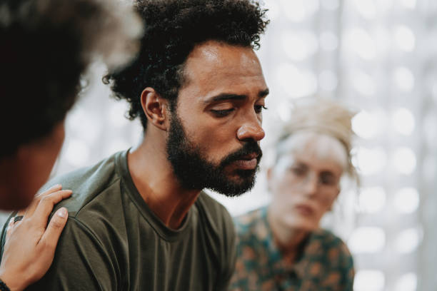 istock Emotional person in mental support group 1708305405