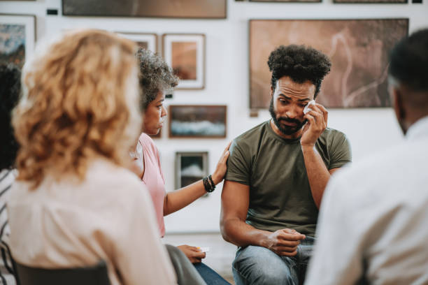 istock Emotional person in mental support group 1708305424