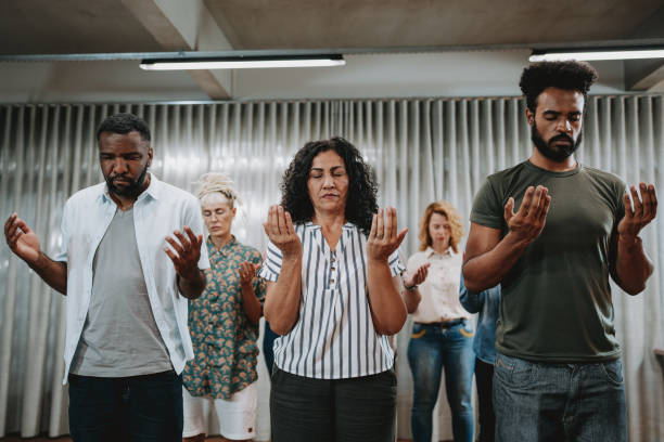 istock Group of people praying for mental support 1708306737