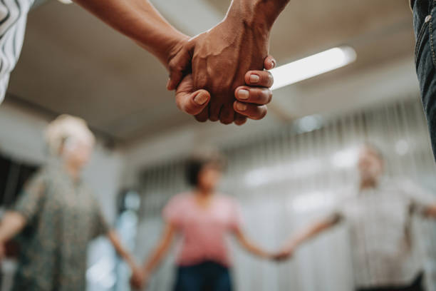 Closeup hands holding mental support meeting