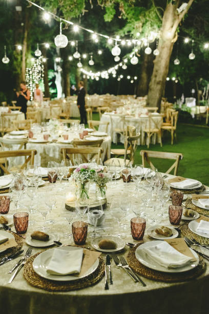 istock Outdoor tables for an elegantly decorated wedding reception, with lovely floral centerpieces and vintage style tableware and cutlery. 1708311708
