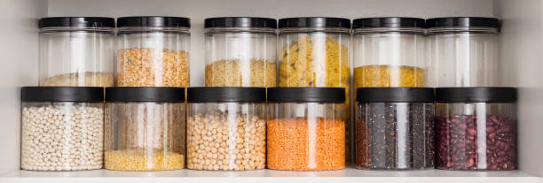 istock Stored containers with grains and pasta in kitchen cabinet 1708318897