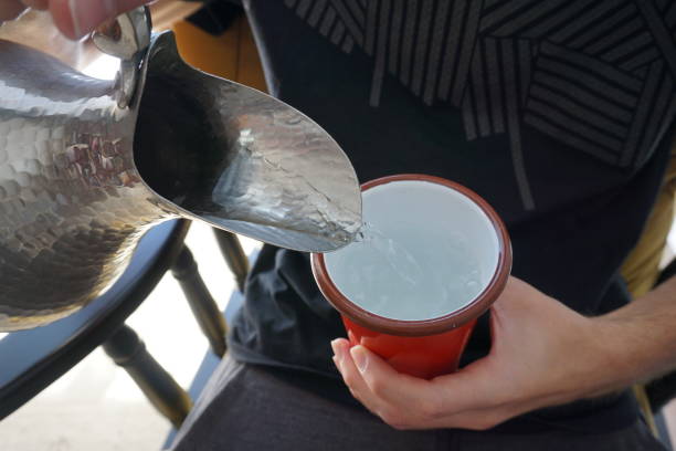 istock pouring water from a jug into a glass. 1708341390