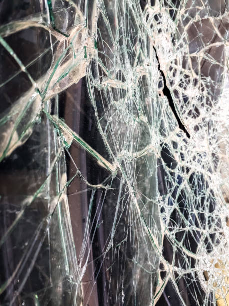 istock Car windshield shattered with stones by vandals. 1708357243