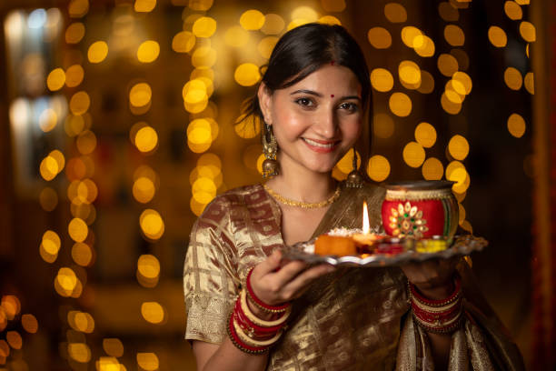 istock Beautiful woman holding religious offering during Karva Chauth 1708375205
