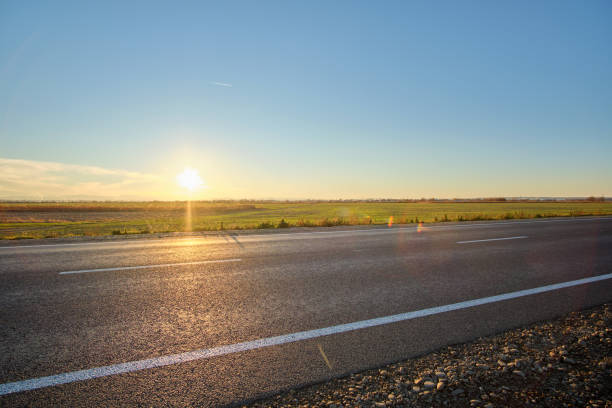istock Empty intercity road with asphalt surface and white markings in evening 1708390456