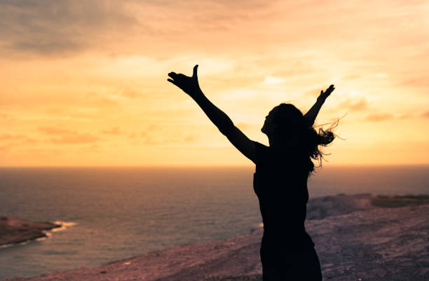 Woman enjoying beautiful view from a mountain top.