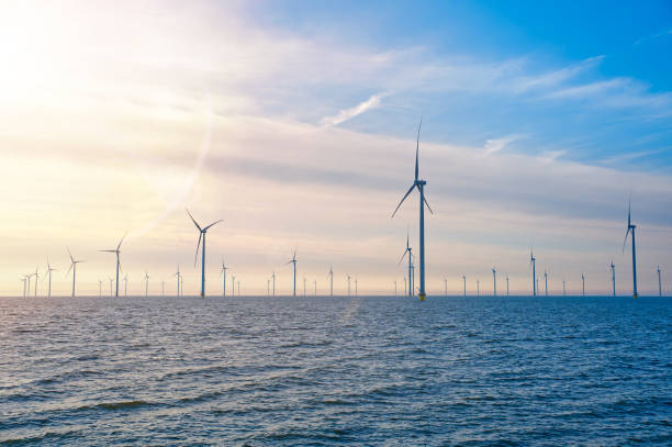 istock Offshore Windmill farm. windmills isolated at sea on a beautiful bright day Netherlands 1708397837
