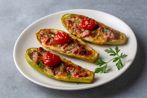 Zucchini stuffed with meat, vegetables and cheese. Zucchini boats. Turkish name; kabak sandal