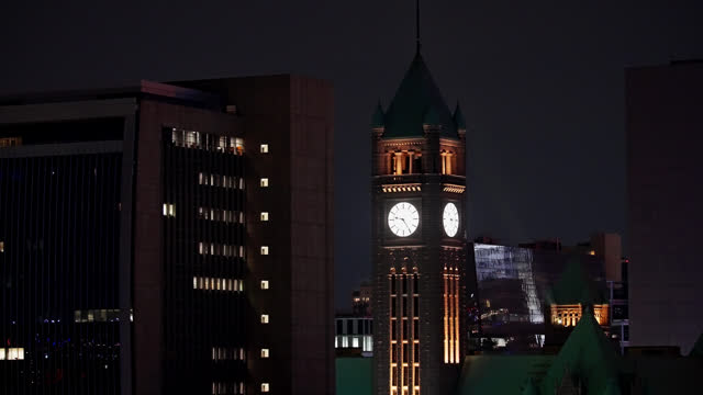 The Minneapolis City Hall Clock Tower At Night In Downtown Minneapolis, Minnesota USA. Aerial Close Up
