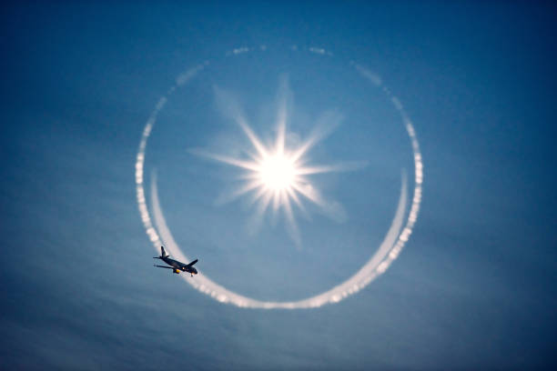 Silhouette of passenger plane crossing the sky, copy space.