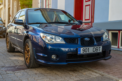 Pärnu, Estonia - September 03 2023: Blue Subaru Impreza 2006 parked in Parnu Old town on a sunny autumn day.
