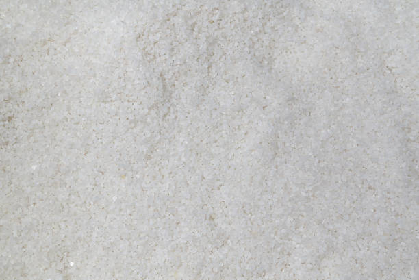 istock Coarse rock salt texture. Background from white sea salt. 1708422300