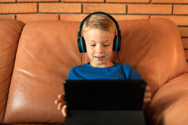 istock Happy little boy watching videos 1708428901