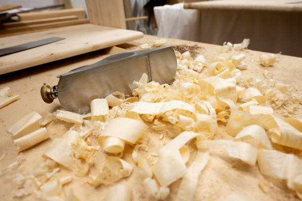 istock carpenter's hand plane with wooden chips. 1708432602