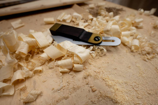 istock Carpenter's protractor with wooden chips on table. 1708432605