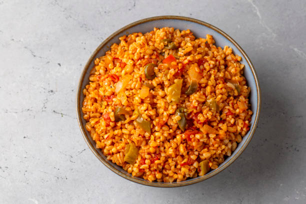 istock Traditional turkish bulgur pilaf with tomato sause in plate (Turkish name; meyhane pilavi) 1708436877