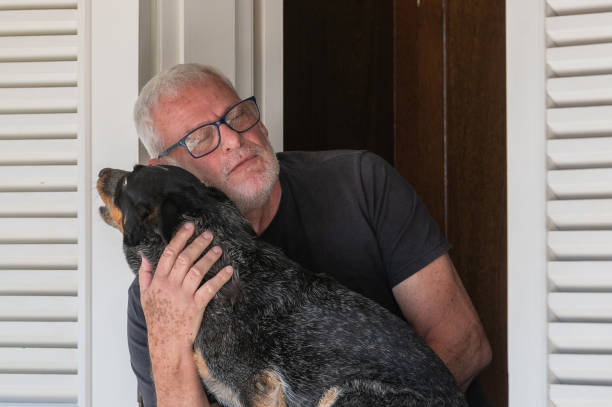istock man with dog at home 1708437370