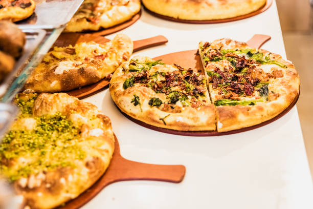 istock Several small Italian style pizzas in a street stall. 1708454591
