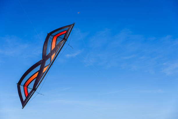 istock Acrobatic Stunt kite flying in the blue sky. 1708457226