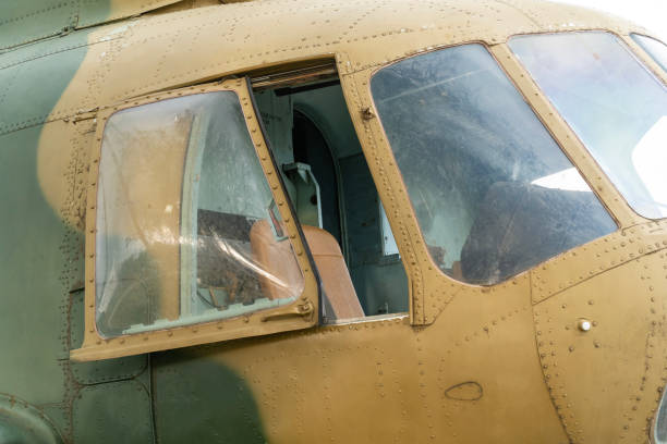 istock Old Soviet-made camouflage Mi-8 military helicopter cockpit 1708463932