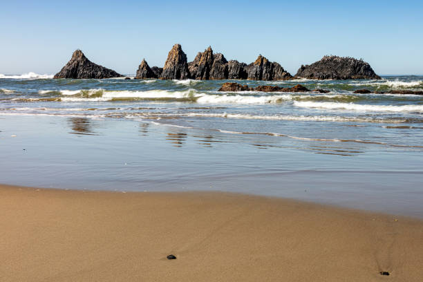 istock Volcanic Rock Seascape Reflections 1708464466