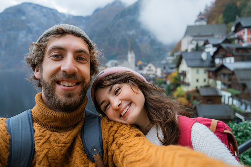Selfie of cheerful  man and woman in Hallstatt