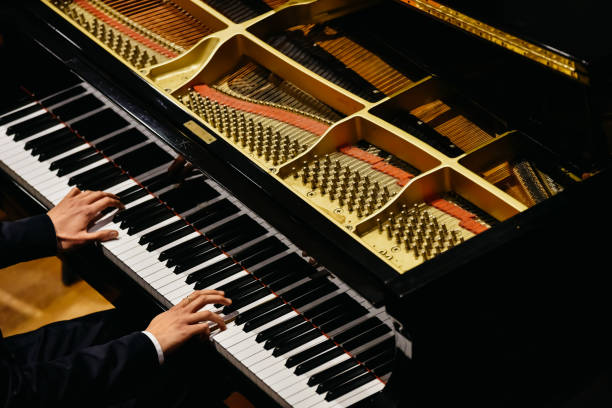istock Hands of classical pianist playing his piano during a concert. 1708484086