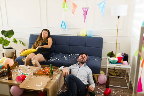 istock Hungover couple waking up with a hangover after a night drinking 1708554314