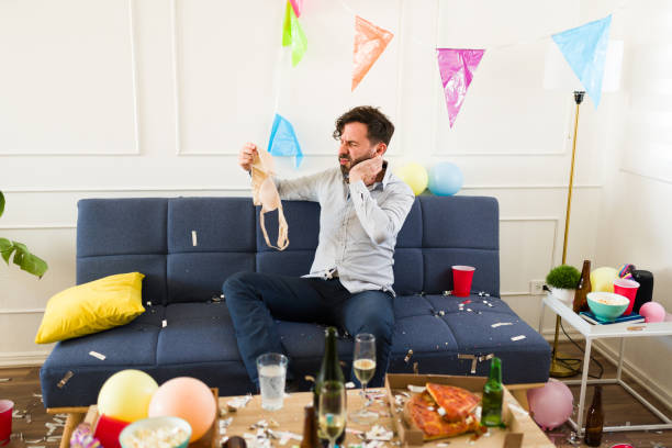istock Handsome man after a night drinking looking confused with a hangover 1708558683