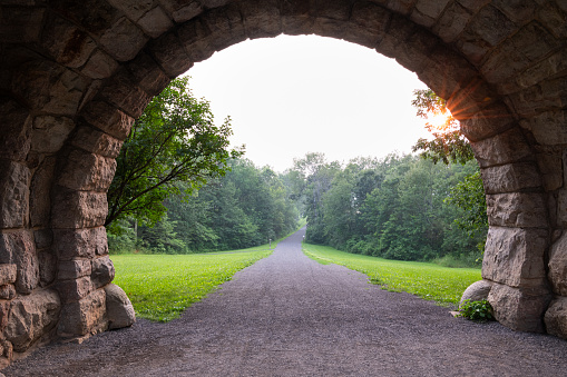 Hazy sunset due to wild fires at Catskill mountains upstate New York featuring road leading to the mountains